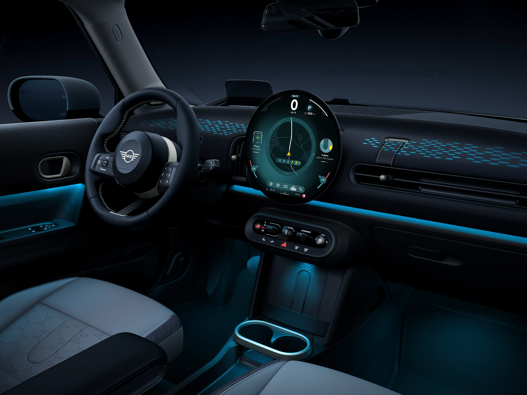 View of the interior of the MINI Cooper with ambient light in blue.