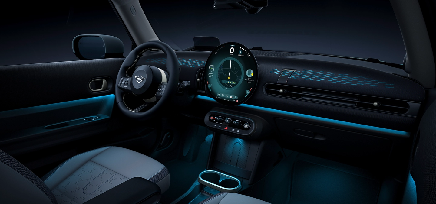 View of the interior of the MINI Cooper with ambient light in blue.