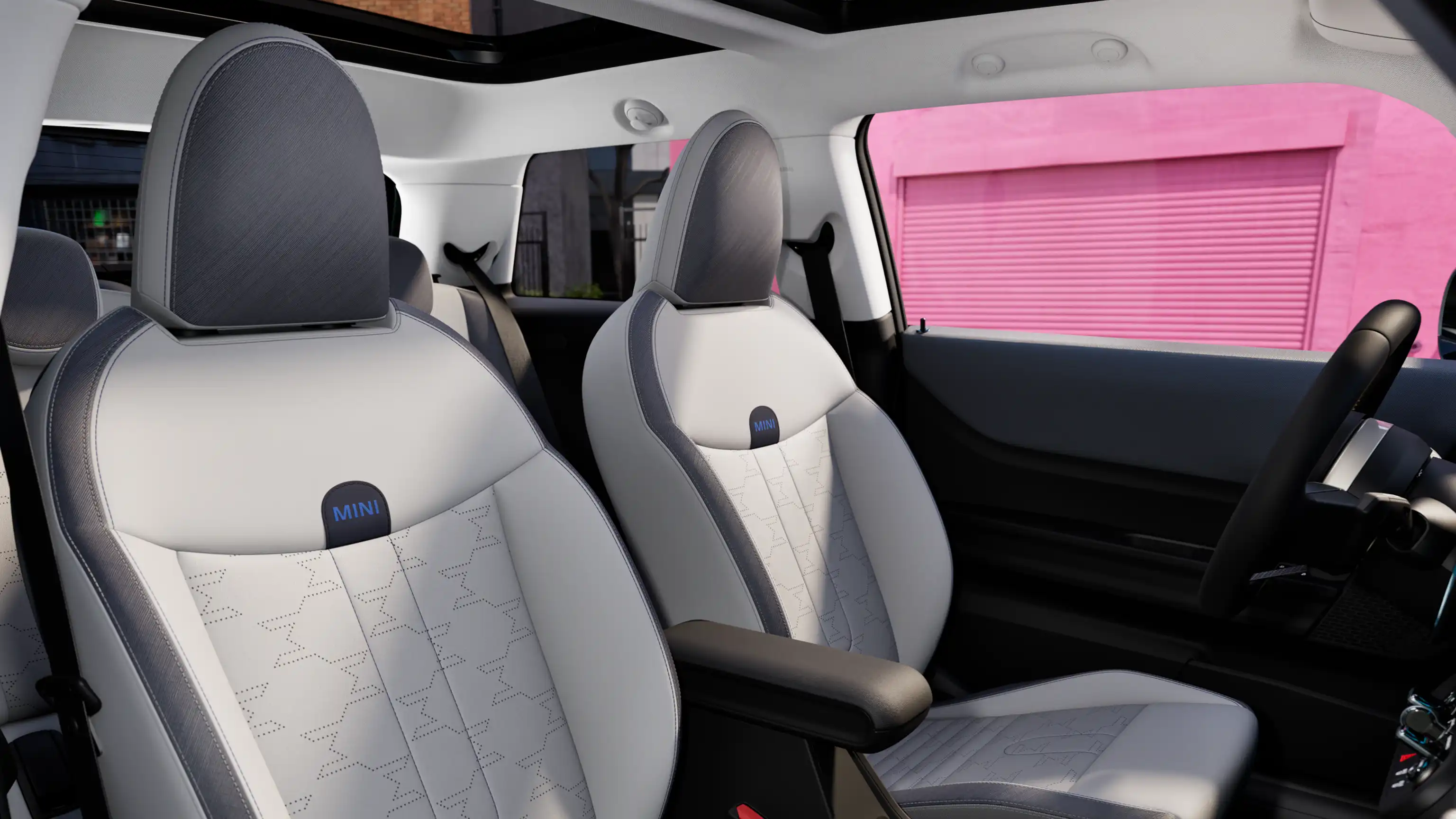 Interior perspective of the MINI Cooper is showing the dashboard, steering wheel, round display, panorama glassroof and back of the frontseats.