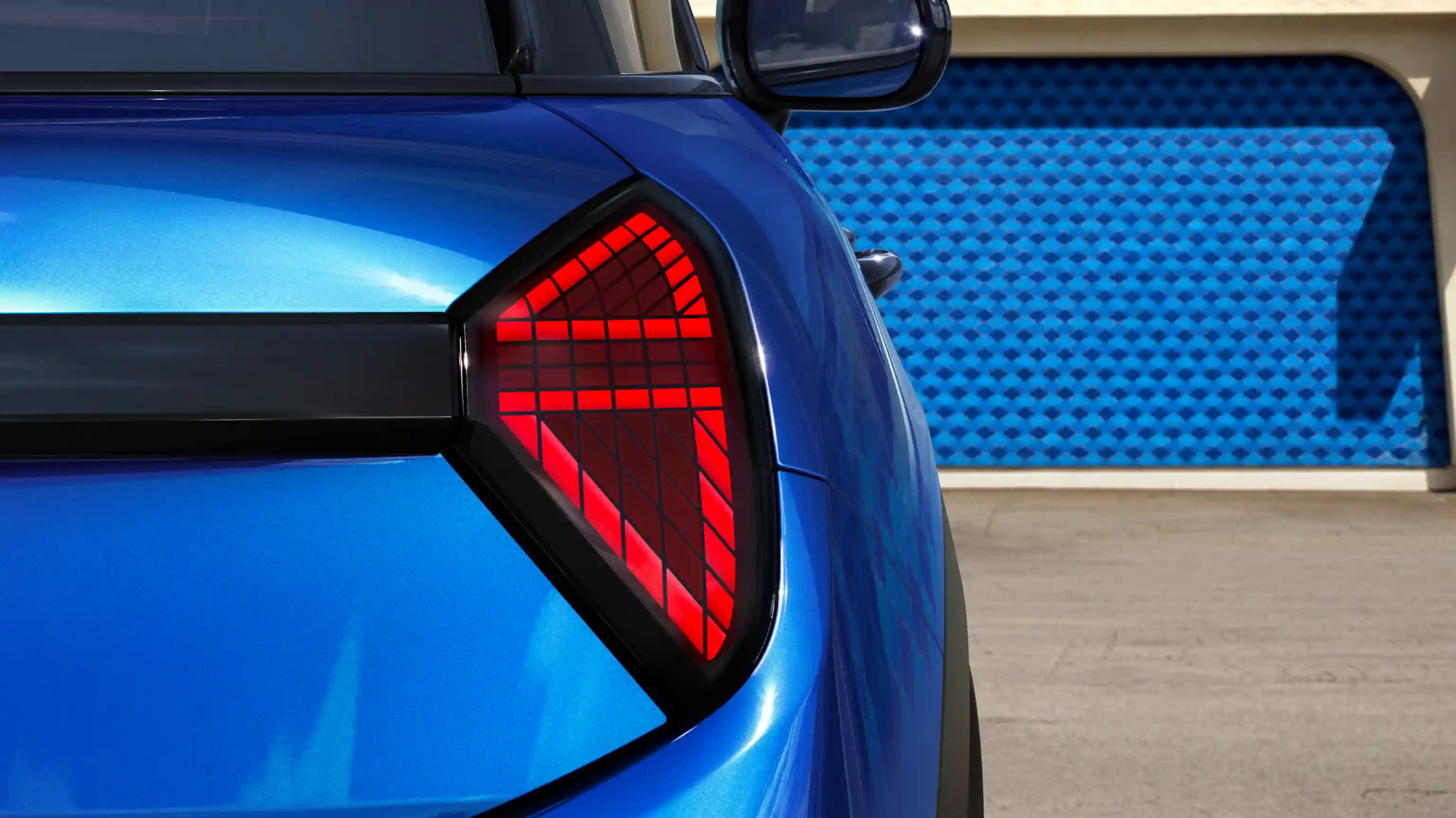 Detail view of the MINI Cooper 5-Door rear light with red lights on