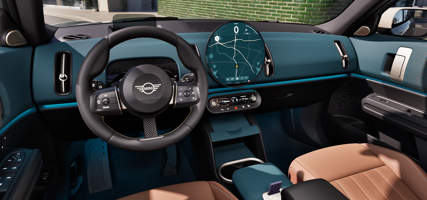 Side interior view of the MINI Countryman with focus on the Dashboard and the steering wheel.