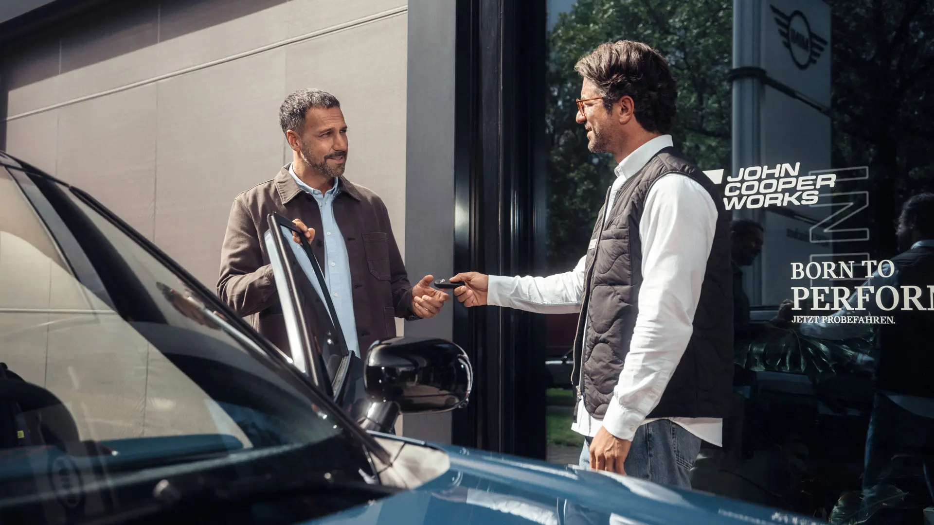 A MINI Service Centre with a service advisor helping a customer.