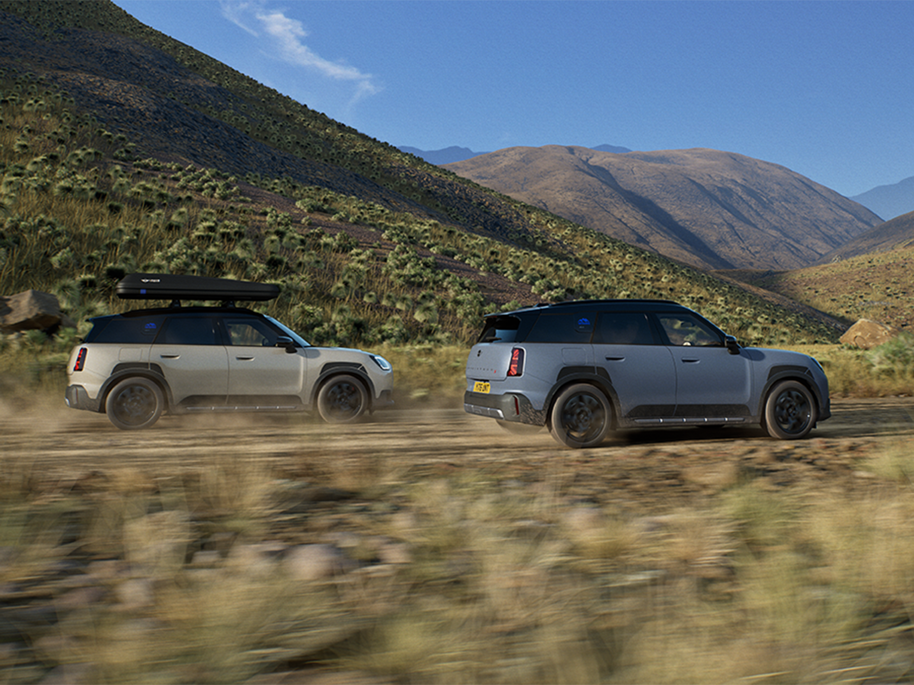 Image of two MINI Countryman Untamed Edition vehicles driving from the back.