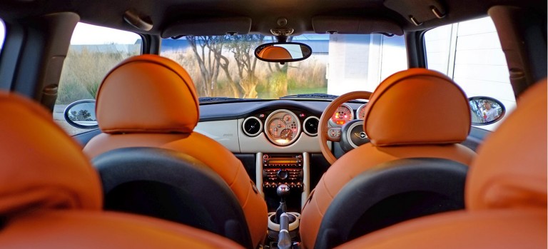 The bespoke tan upholstery on the seats and steering wheel was hand-stitched by specialist craftsmen.  